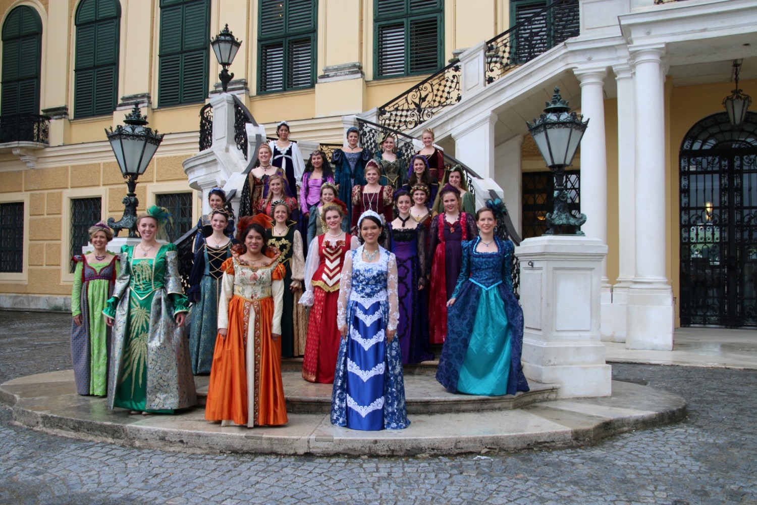 Group in formal dress outside a historic European venue