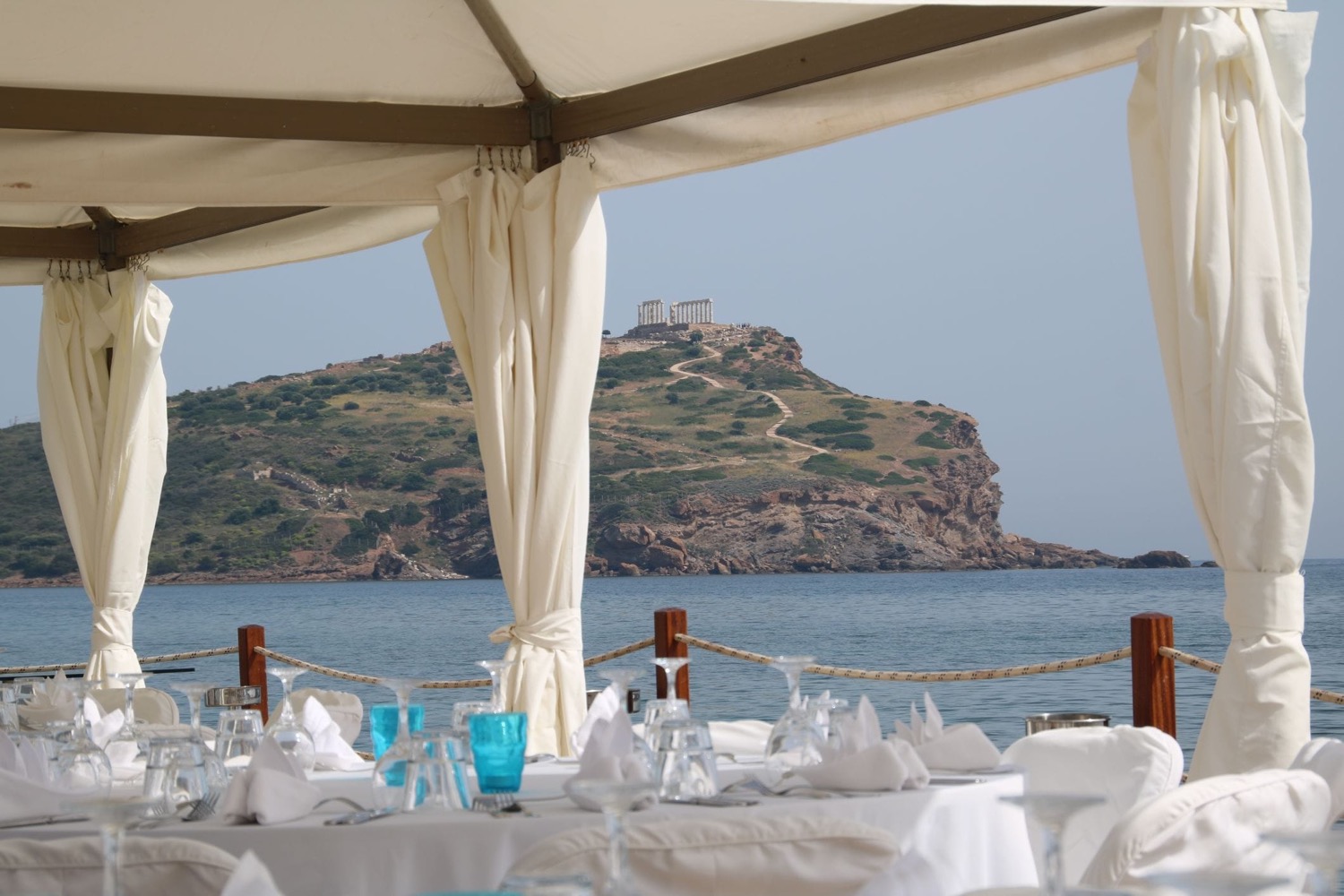 Seaside dining setup prepared for a Q Events program