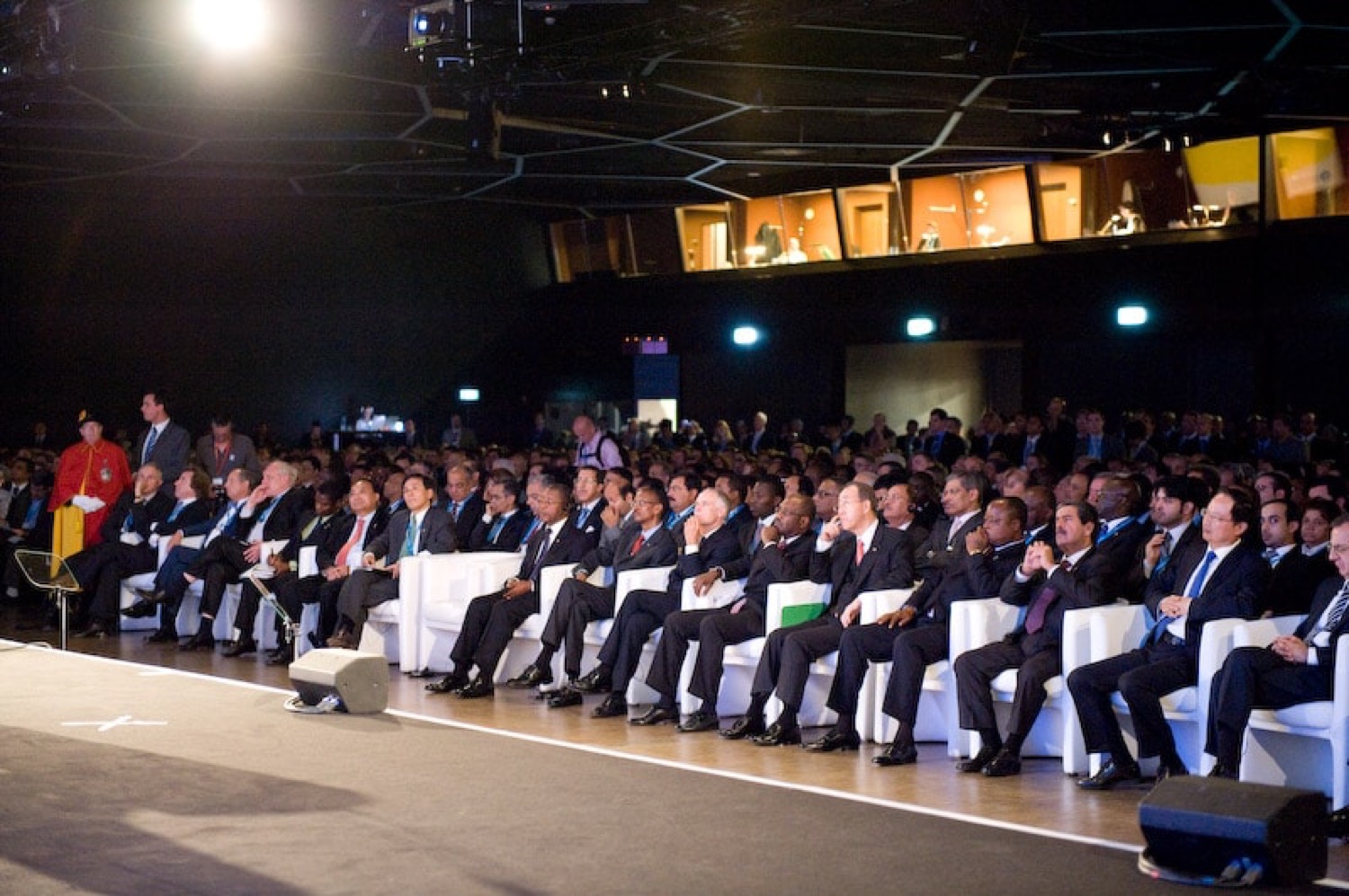 Seated audience at an indoor conference program