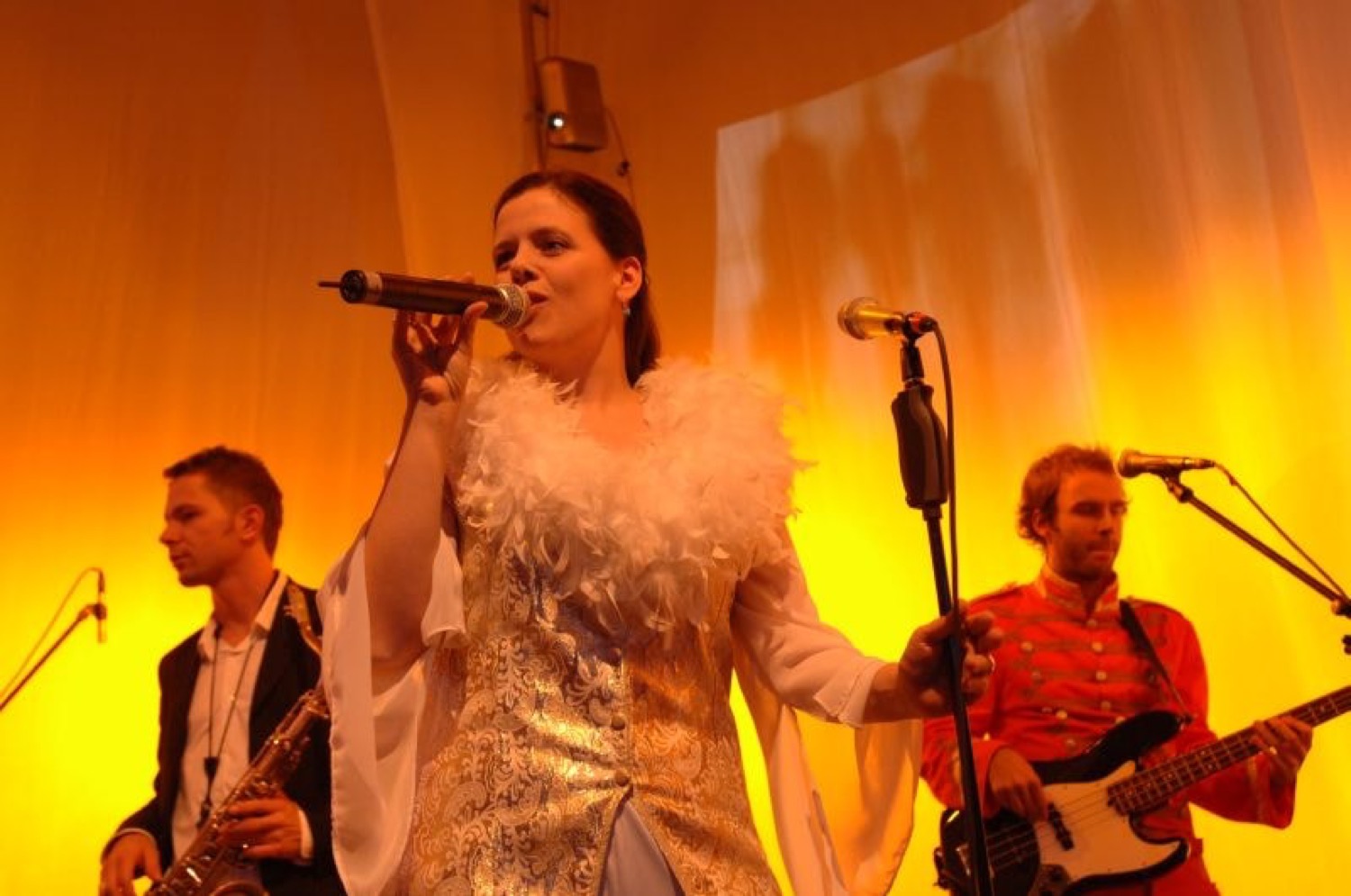 Live singer performing on stage at a Q Events program